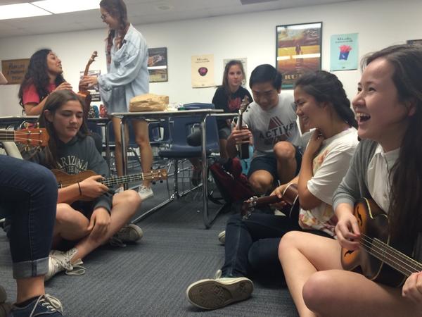 The Ukulele club members play with their instruments (Staff Photographer/Talon).