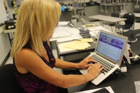 Biology teacher Winnie Litten prepares for her class using the new Google Classroom technology. This technology is being implemented schoolwide in order to go paperless and prepare students for the job market (Staff Photographer/Talon).