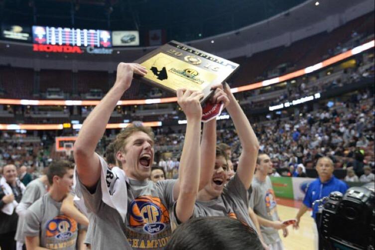 Senior+Kobi+Weinberg+and+junior+Chris+Stone+hold+up+the+CIF+championship+plaque+%28Photographs+courtesy+of+Matt+Whealen%29.