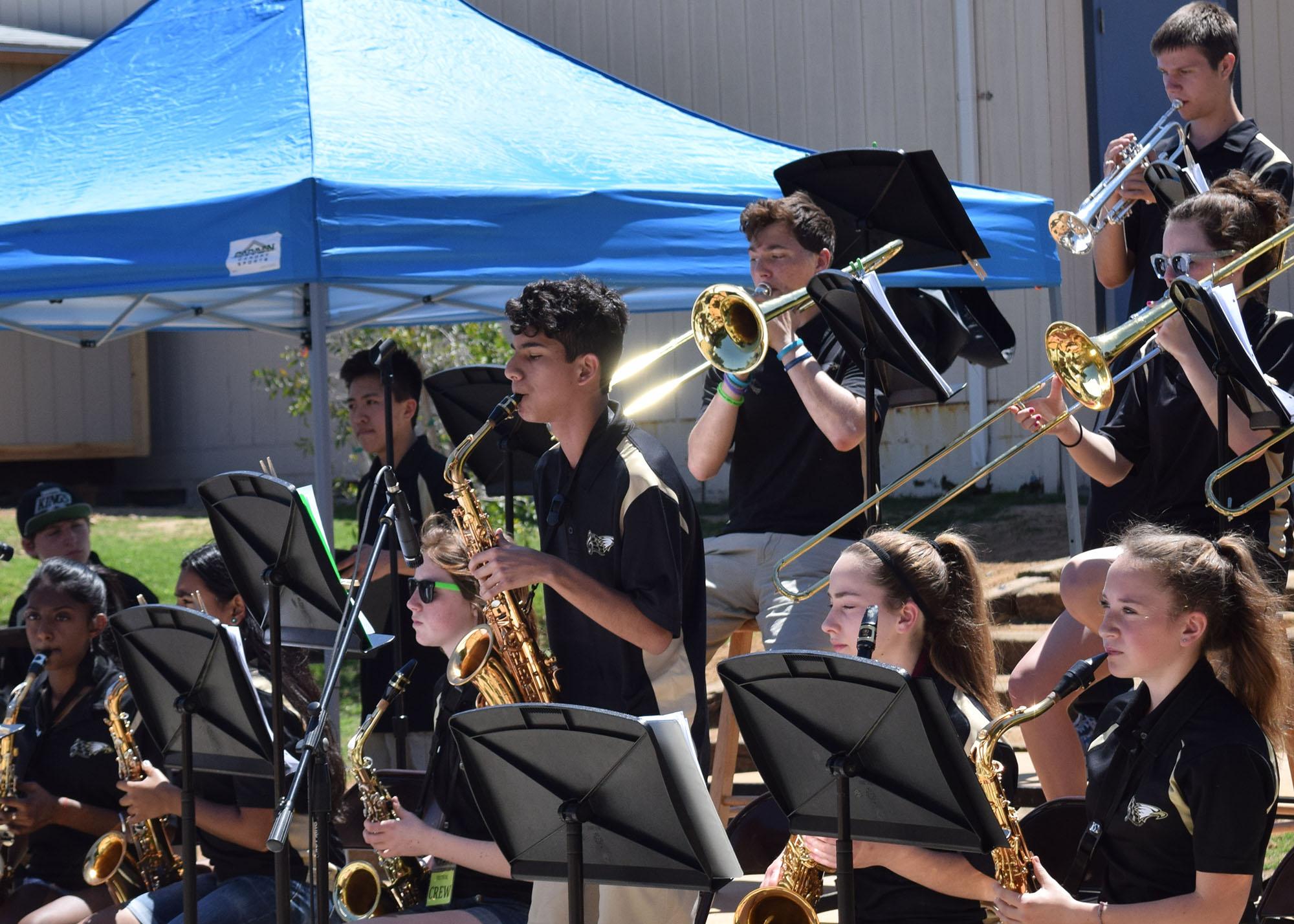 The high school jazz band performs in the amphitheater at Medea Creek Middle School April 17. Performing along with the jazz band were the high school concert band, wind ensemble and choir (Meghana Mudunuri/Talon).