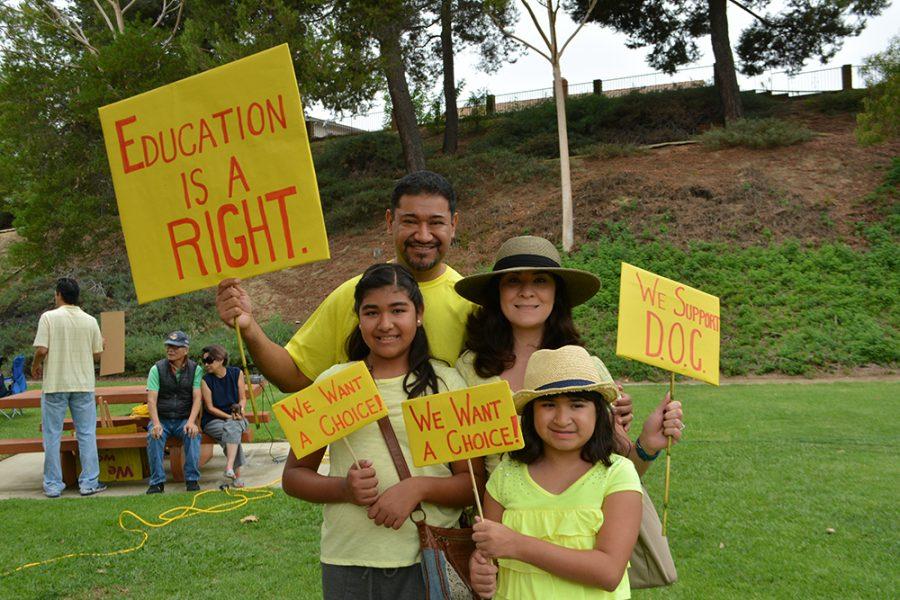 Family+comes+to+protest+in+support+of+the+District+of+Choice+program.+The+district+of+choice+program+offers+out+of+district+kids+to+attend+the+school+of+their+choice+%28Nick+Burt%2FTalon%29.