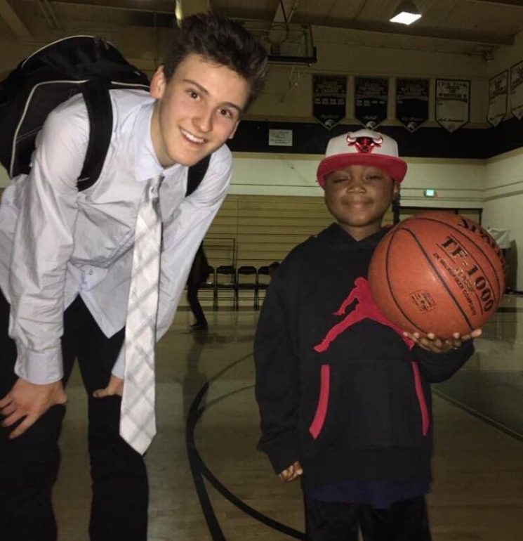 Luc+Bodden+poses+with+senior+Wes+Slajchert+after+a+basketball+game.+The+Municipal+Advisory+Council+unanimously+voted+to+make+Sept.+14+Luc+Bodden+Day+%28photo+courtesy+of+Wes+Slajchert%29.
