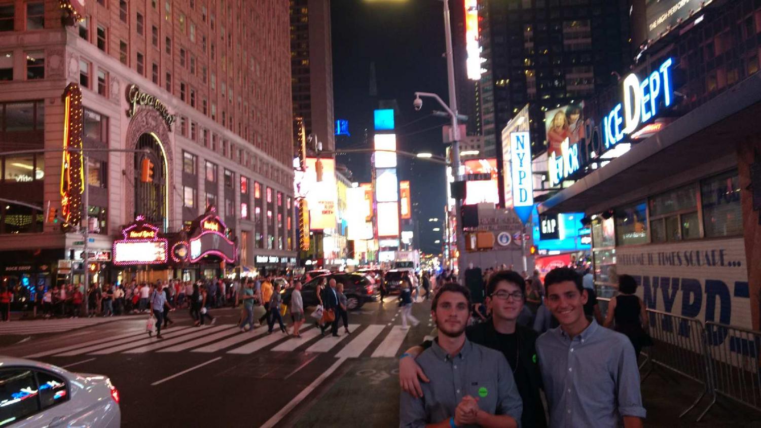 Juniors Aiden Glikmann, left, and Benjamin Fuller, center, pose in Times Square. Glikmann and Fuller were invited to participate in the International High School Film Festival in New York City for their short- lm “The Stall” (photo courtesy of Ben Fuller).