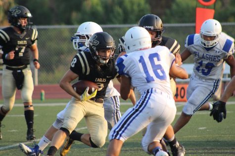 Varsity football team wins at home
