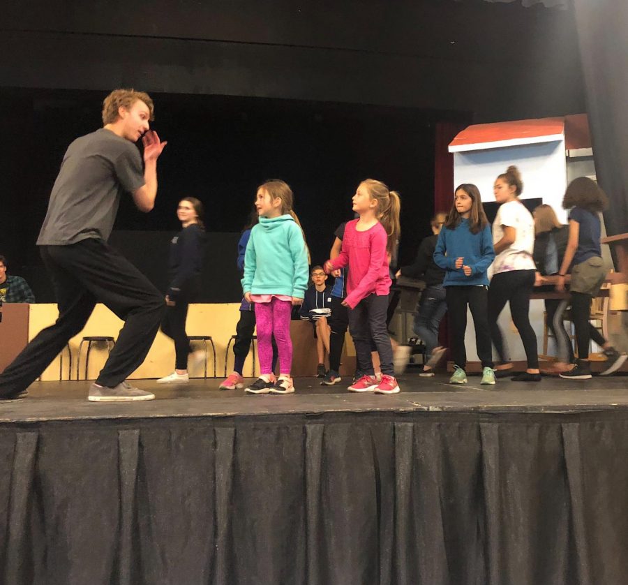 Jeremy+Orriss+performs+along+side+students+form+local+elementary+schools+during+practice+for+the+spring+musical%2C+%22The+Music+Man.%22