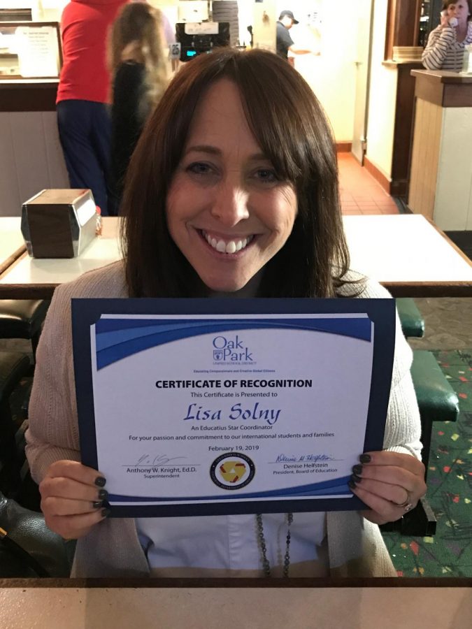 Lisa+Solny+poses+with+her+certificate+of+recognition+from+OPUSD+board+members.