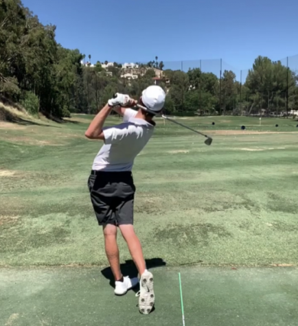 Senior Kelly Dobson swings to hit a golf ball at the Calabasas Country Club.
