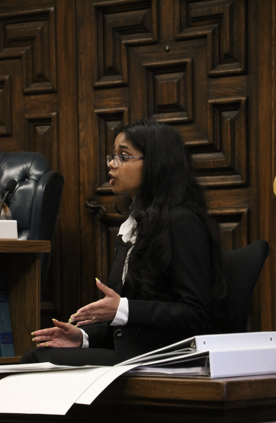 Sophomore Nidhi Dhunaka takes to the stand portraying expert witness Parker Turner, a doctor testifying for the defense, as a member of the Black Defense team.