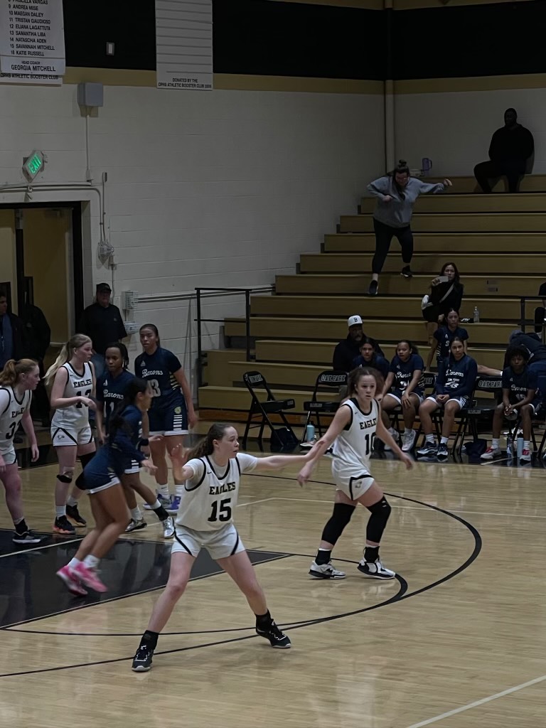 Maya Deshautelle and Delaney White guarding on defense 