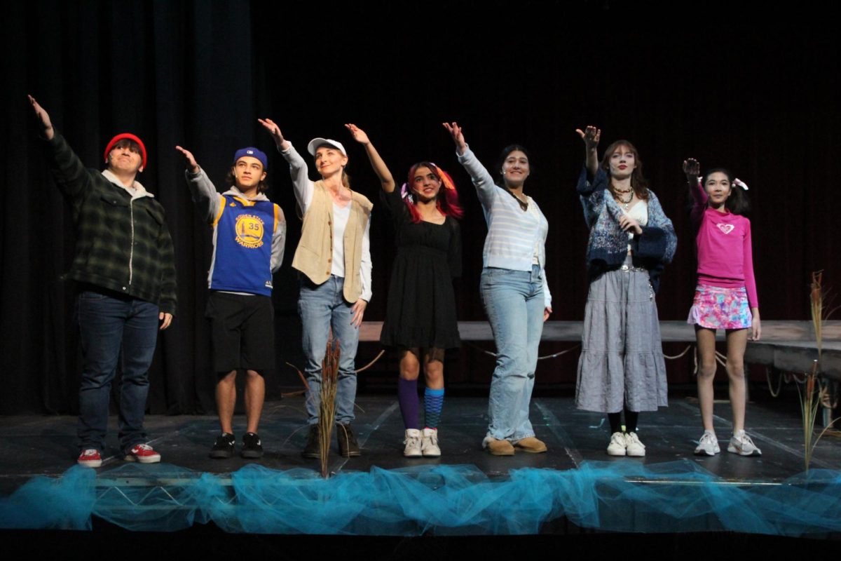 Cast members take a bow after the show