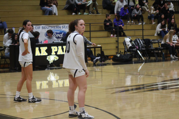 Junior Delaney White and Ava Rogerson wait for the ball to get back in play