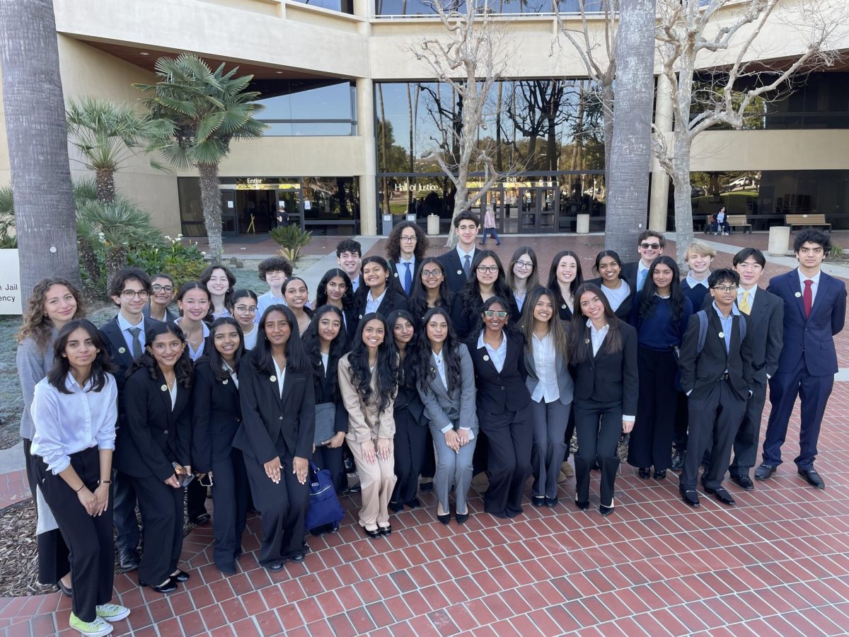 Students pose for a group photo before the competition begins.