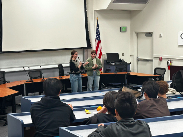 Club presidents Ava Winkle and Maria McNeilly lead a club meeting