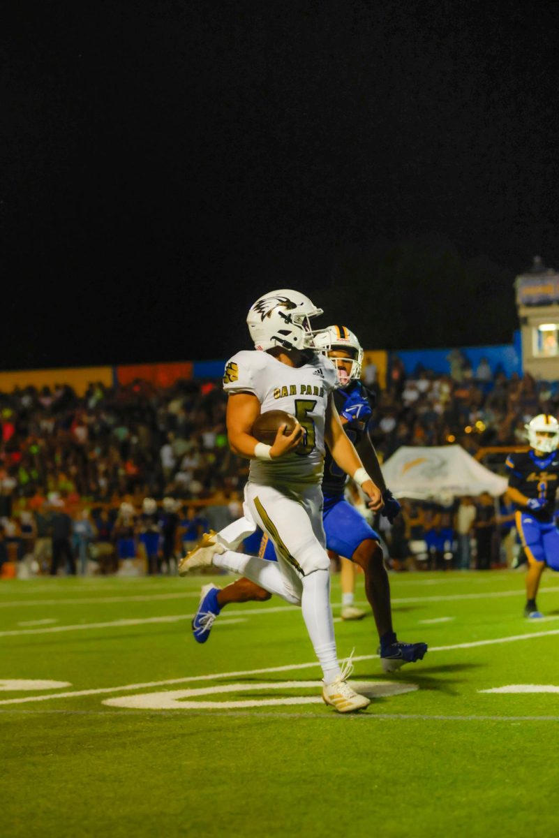 Auzat, No. 5, defending the ball against Agoura.
