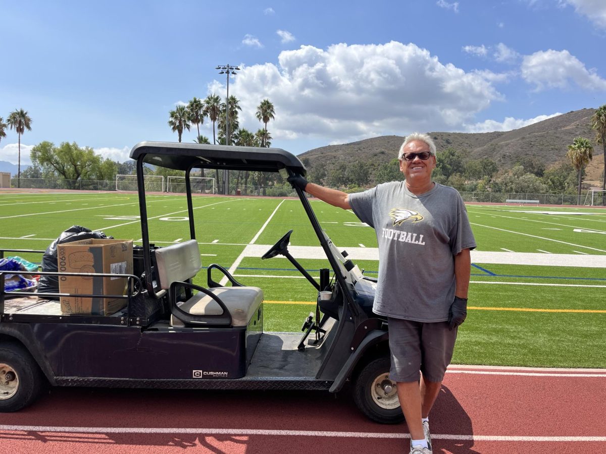 Head custodian Richard Ortega stands in front of the OPHS football field (Photo by Kelsey Frieborn/ The Talon)
