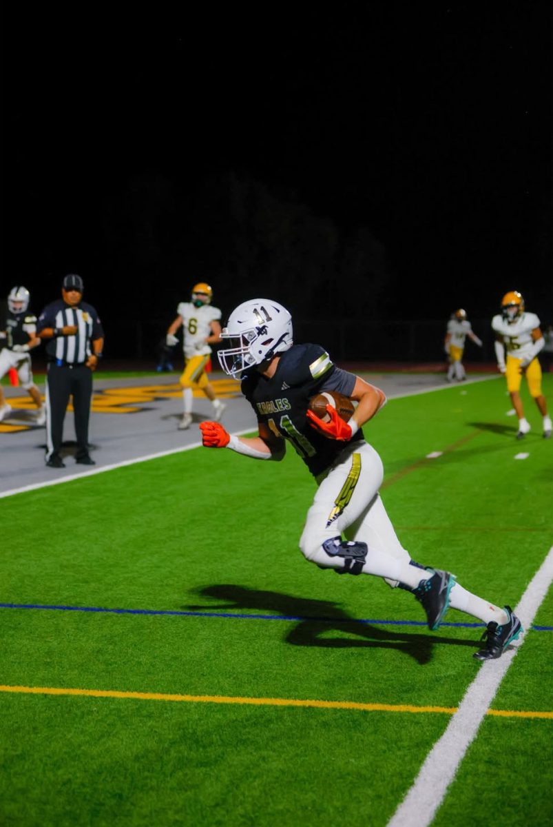 Braddock running the ball. (Photo by Jackson Thayer/OPHS Flicks)